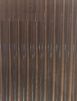 Brown fluted louver panel with vertical ridges and metallic sheen, showcasing a textured surface with reflective highlights.