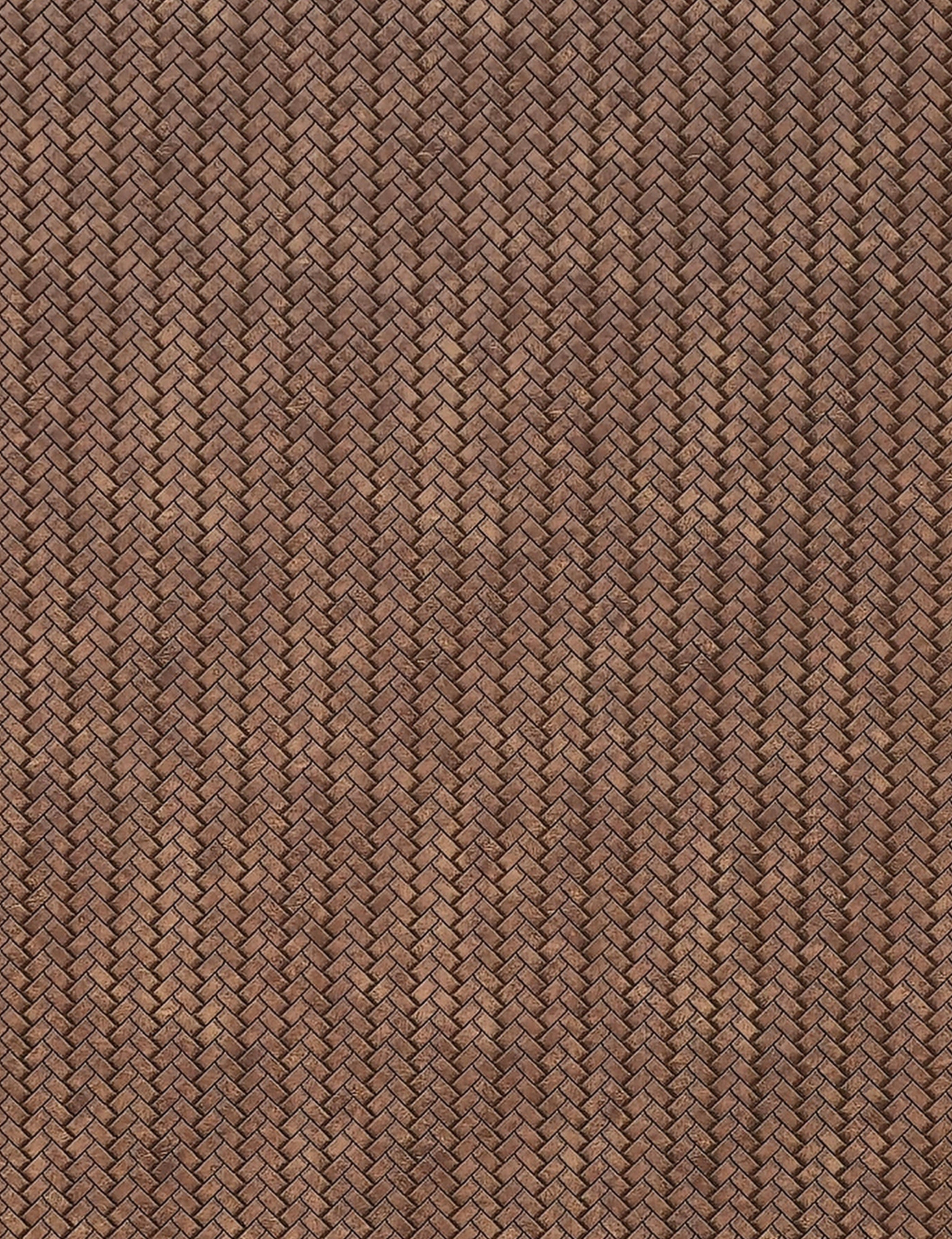 Brown textured wall panel with woven cane pattern and diagonal grain direction.