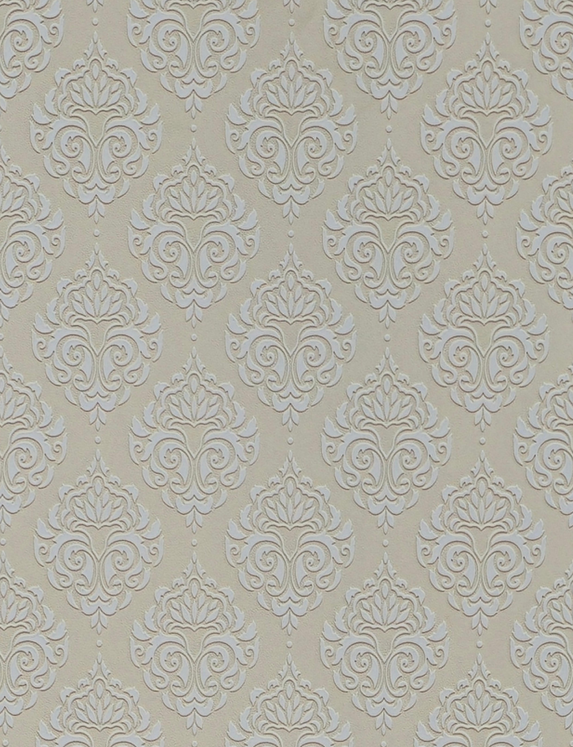 Beige wall panel with white embossed damask pattern and textured finish.