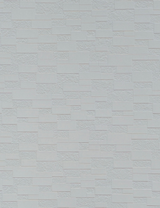 White textured wall panel with a brick pattern and rough surface finish.