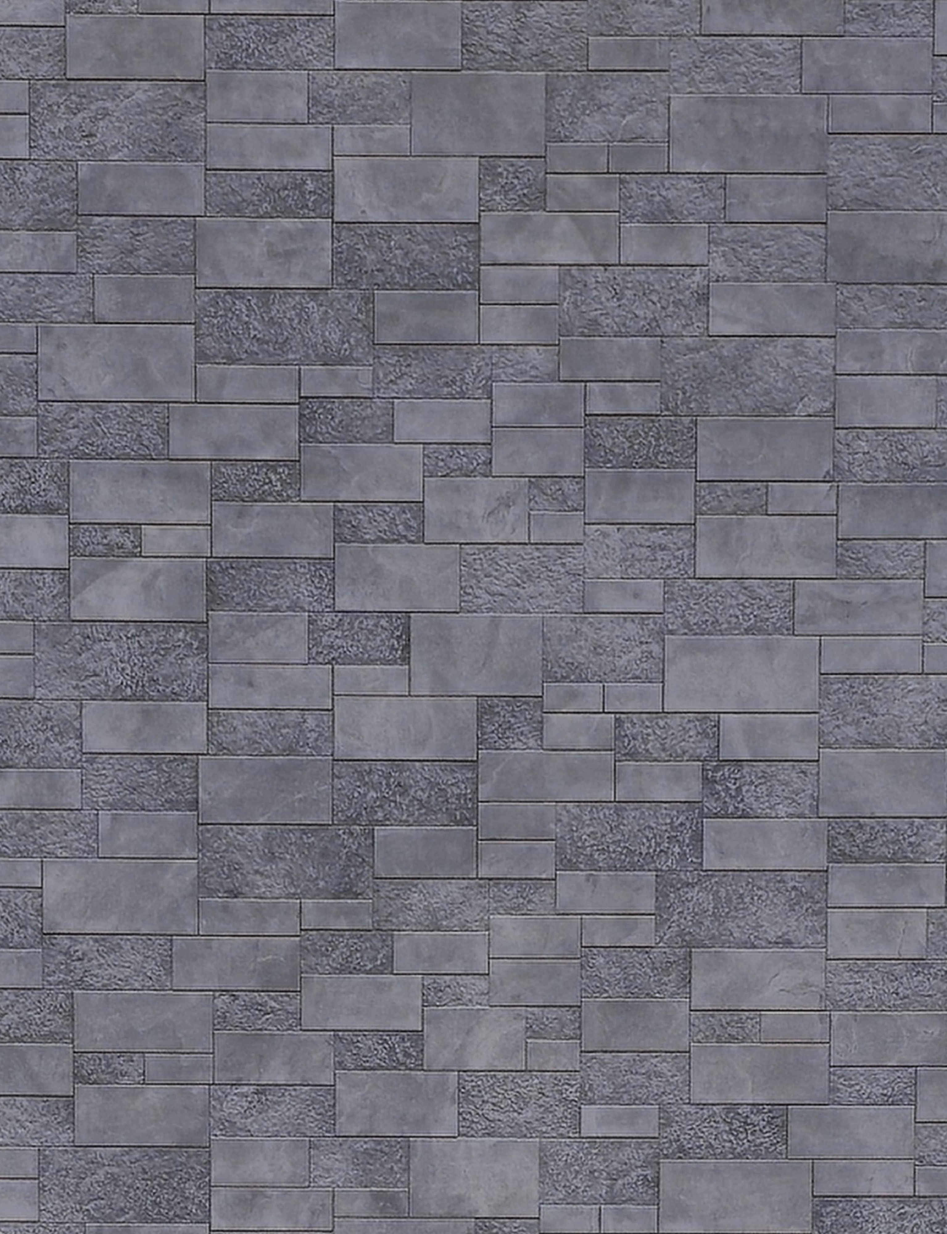 Gray wall panel with textured, rectangular tiles in a staggered pattern.