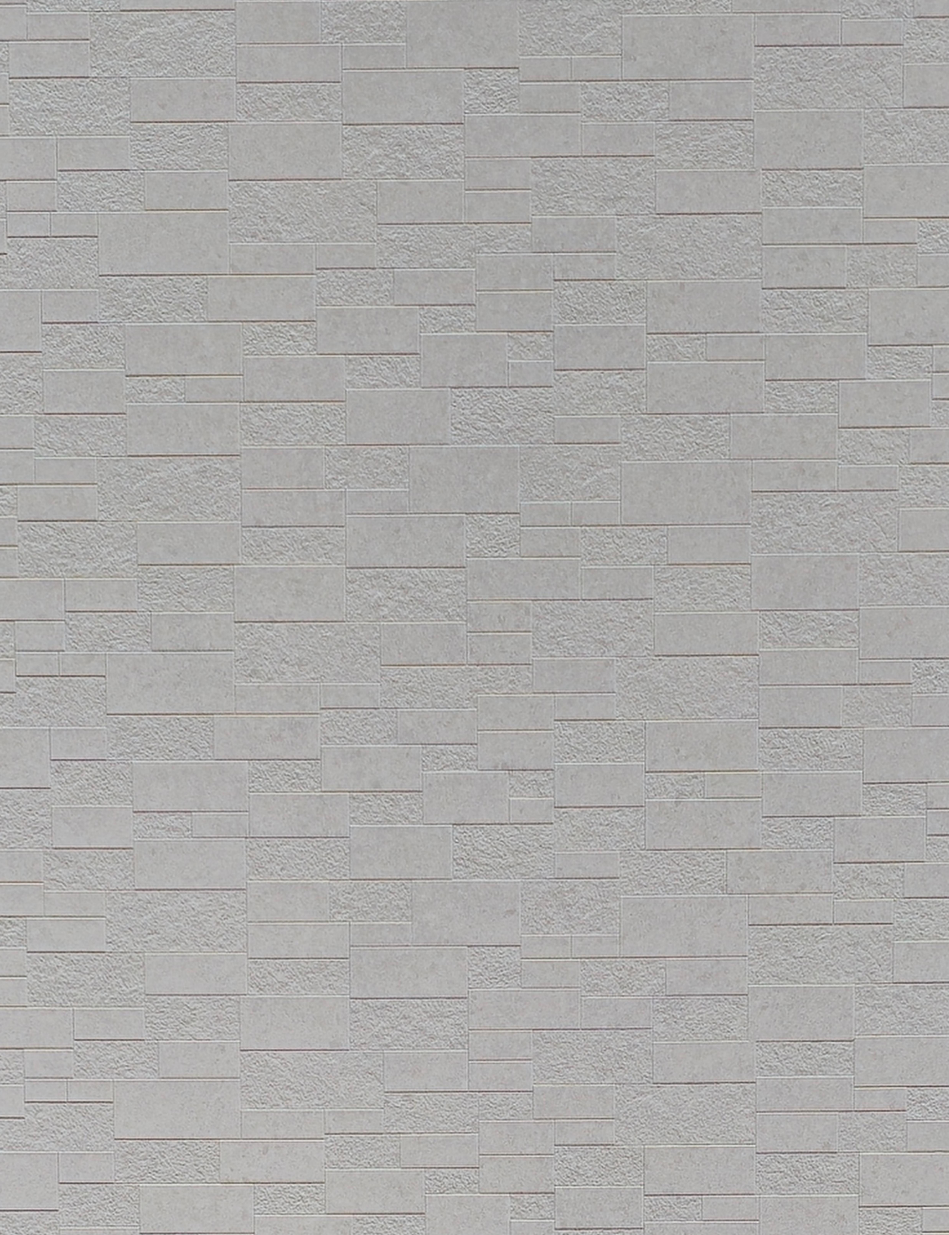 Light gray wall panel with textured, rectangular brick pattern and subtle sheen.