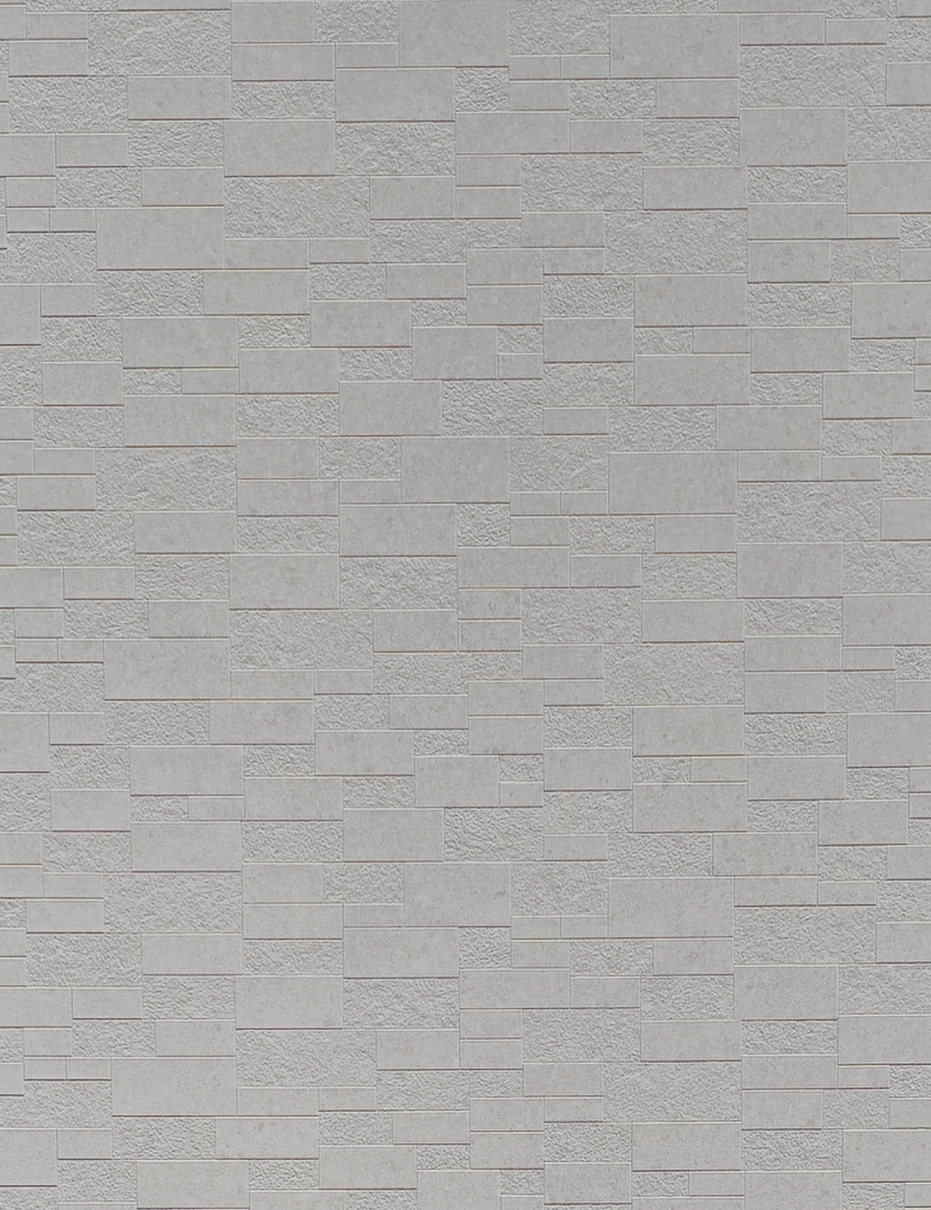Light gray wall panel with textured, rectangular brick pattern and subtle sheen.