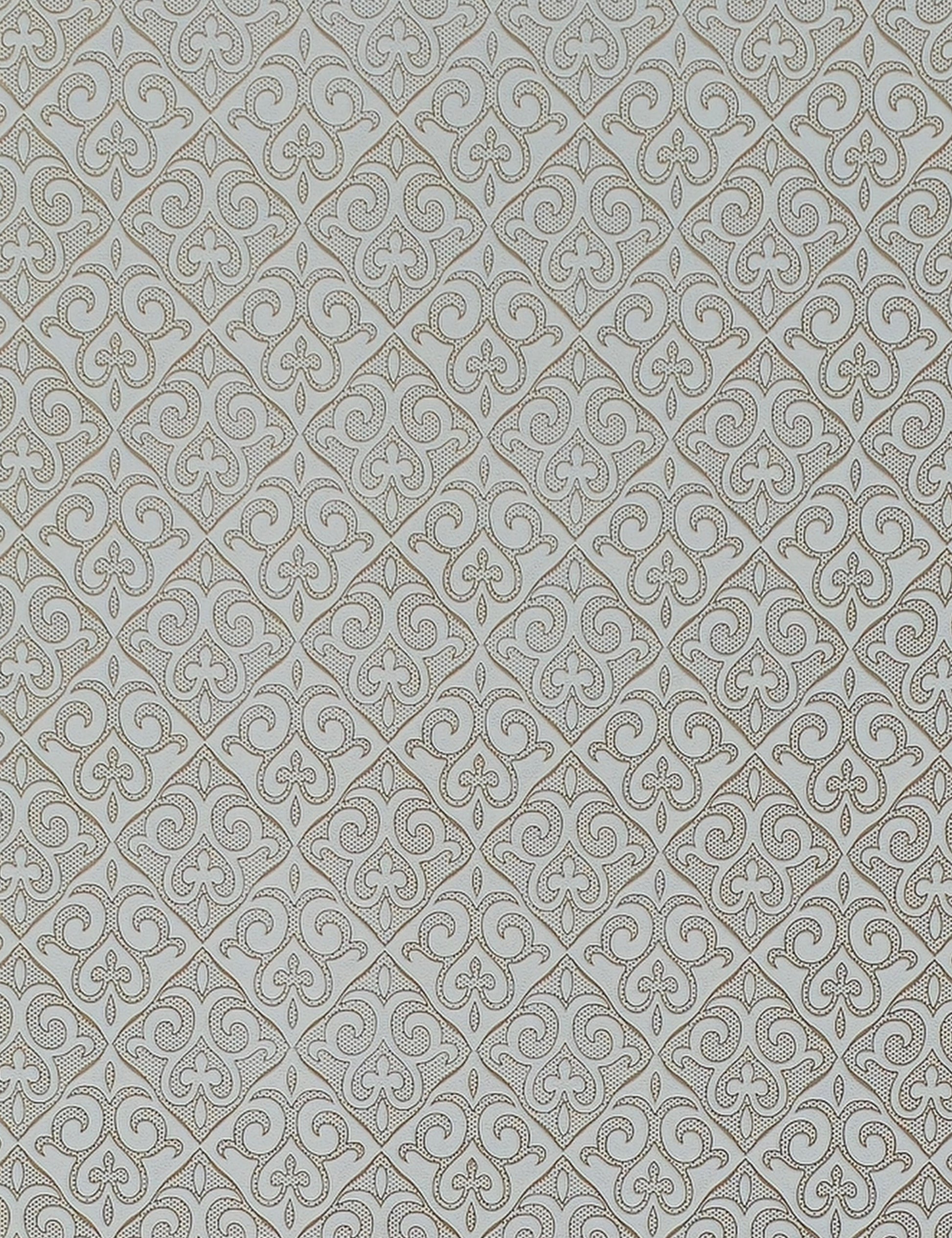 White wall panel with intricate, repeating diamond pattern and textured design.
