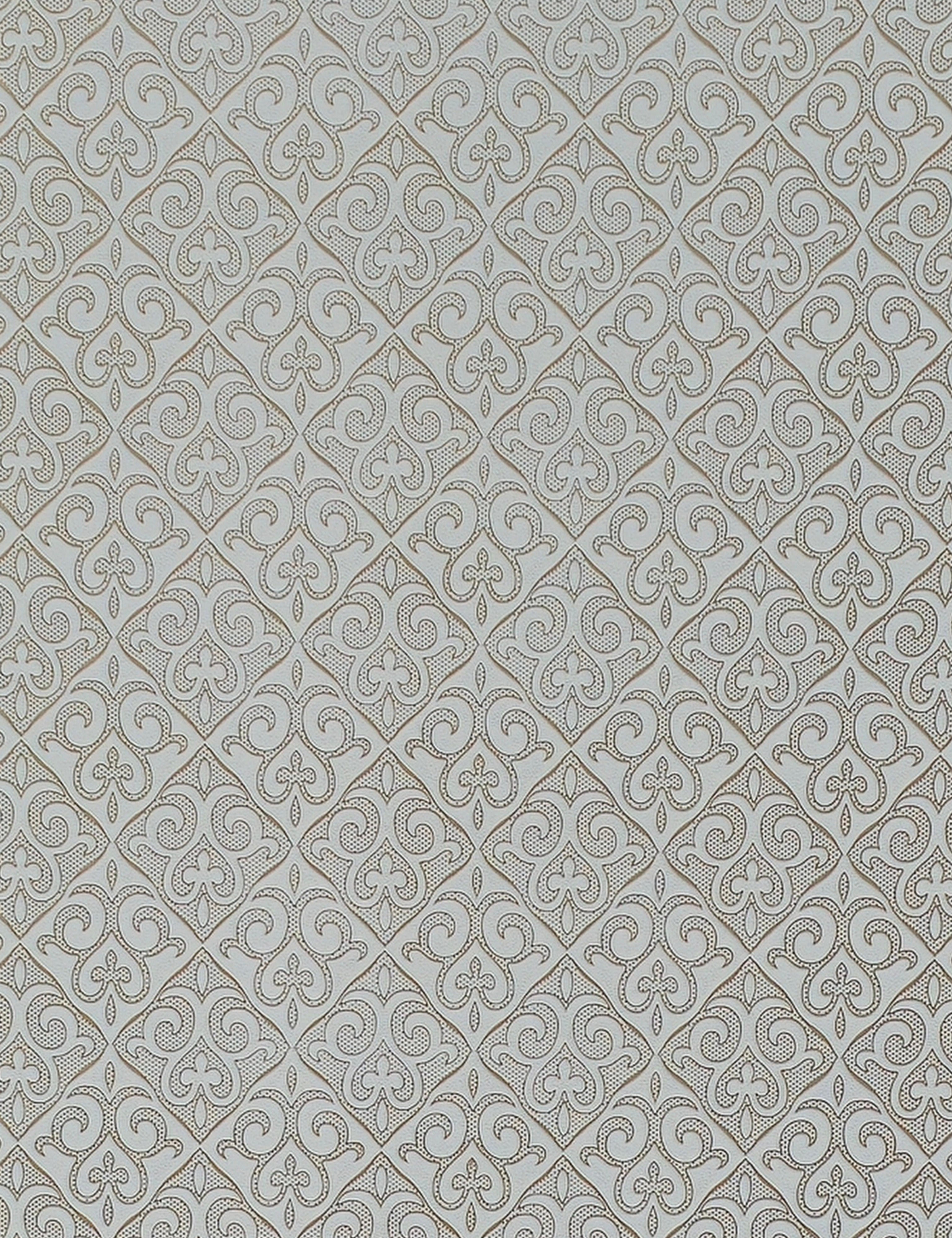 White wall panel with intricate, repeating diamond pattern and textured design.