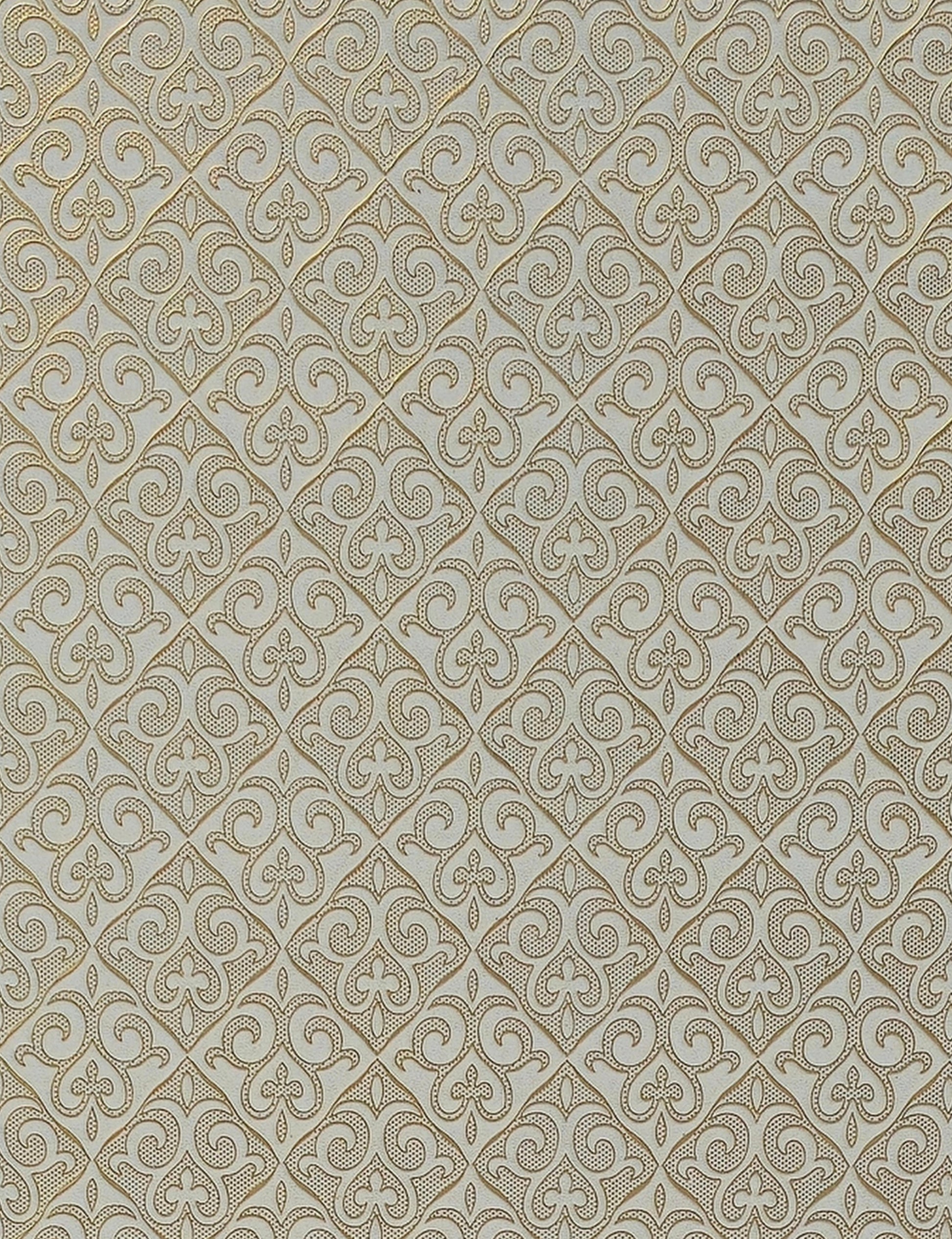 Gold ornate geometric pattern on beige wall panel with textured finish.