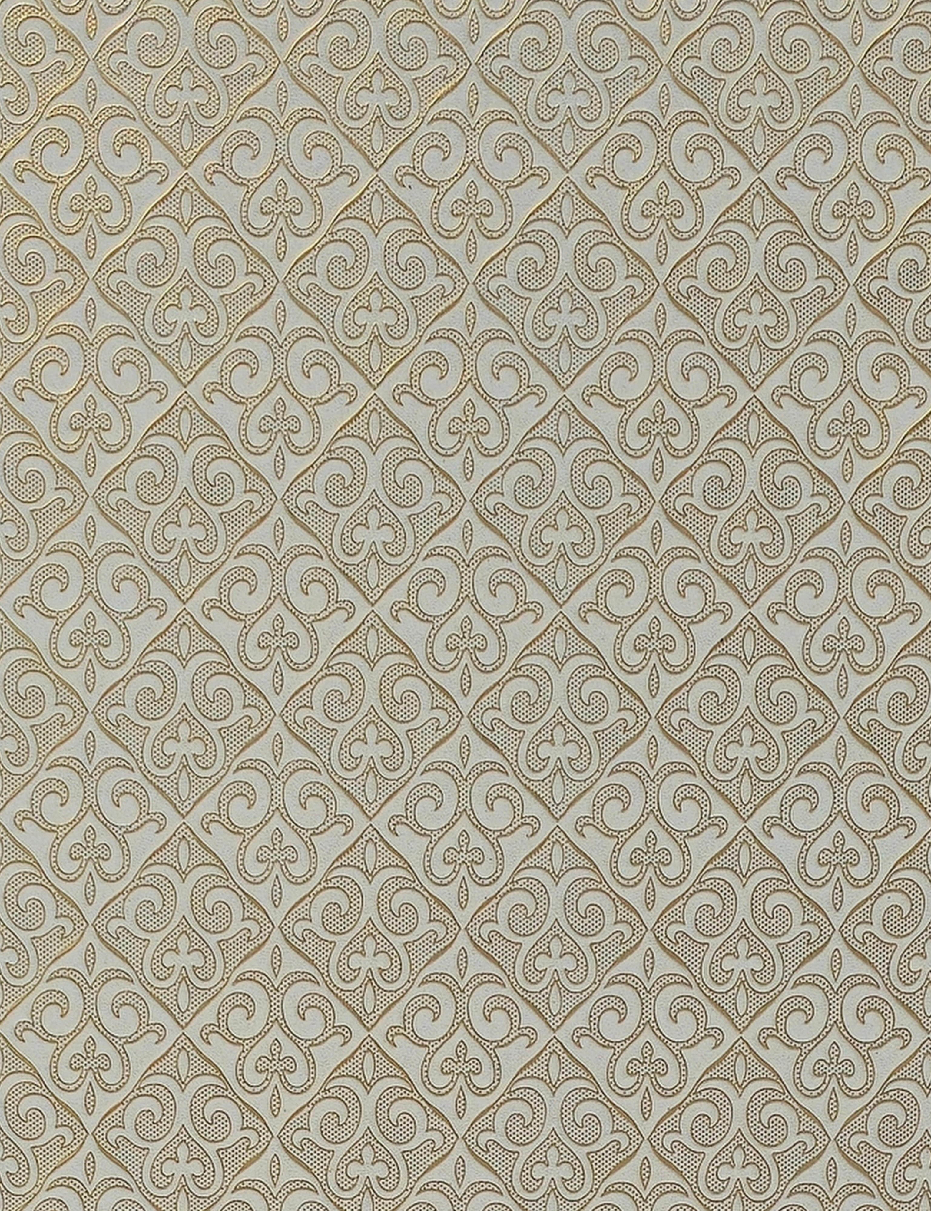 Gold ornate geometric pattern on beige wall panel with textured finish.