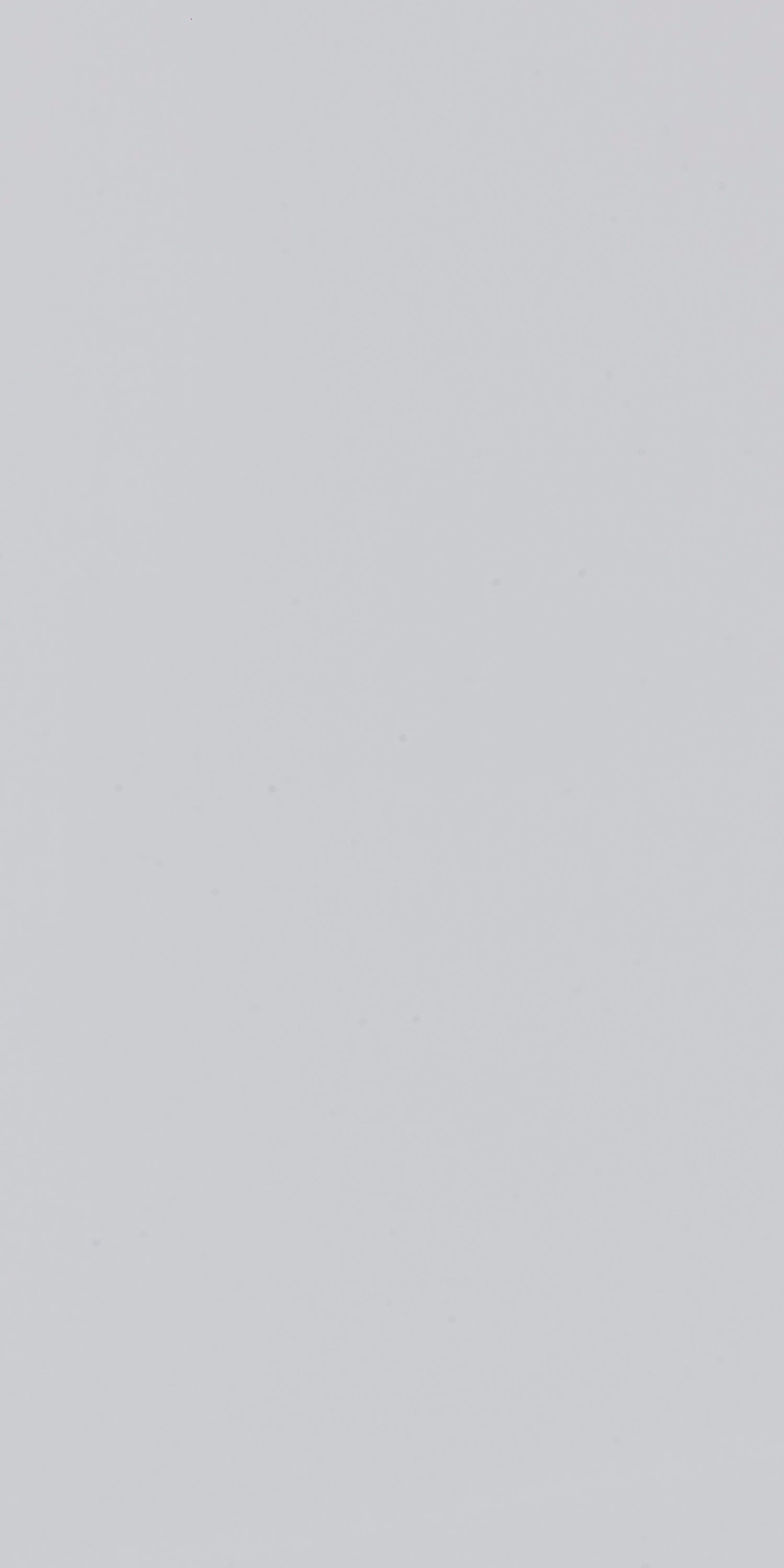 Grey solid color laminate wall panel with matte finish and smooth texture