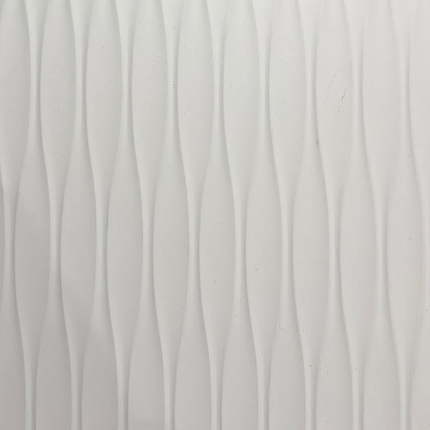Brown wood louver panel with textured finish and wood grain pattern visible on the surface of the material.