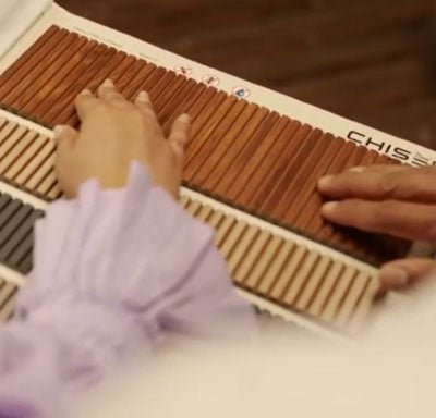 Brown wooden louver panel with textured finish and slatted pattern, showcasing natural wood grain and varying shades.