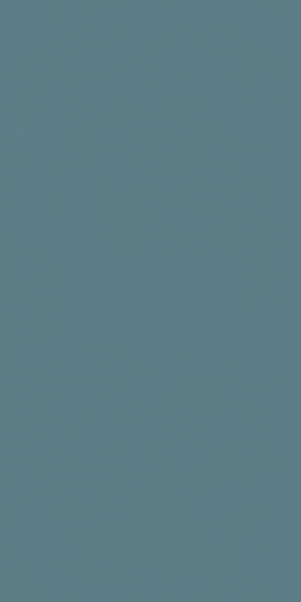 Grey suede finish plain laminate with smooth texture and matte sheen, used for interior decoration and design applications.