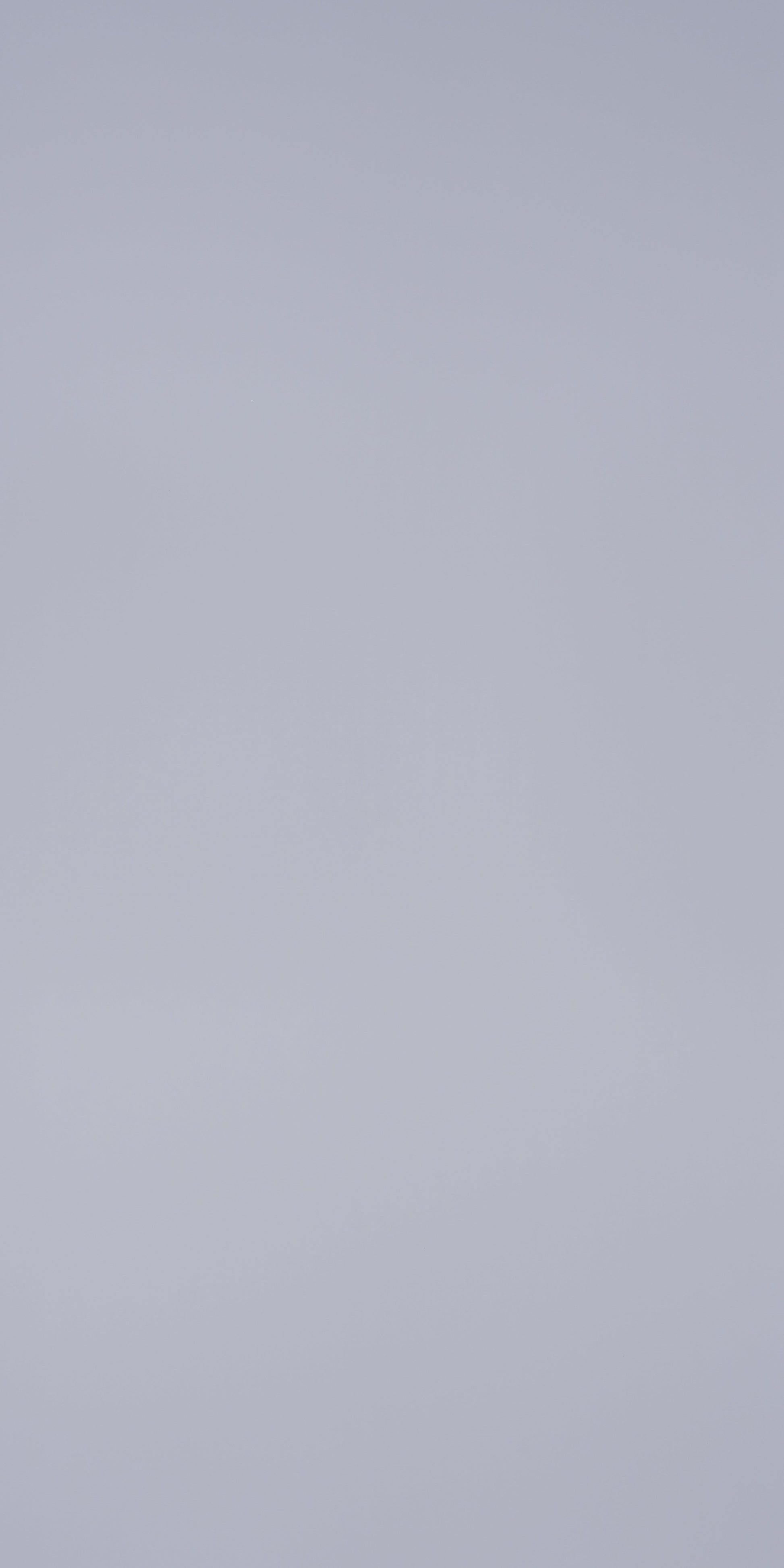 Bluish grey high gloss solid color laminate wall panel with smooth finish and reflective surface