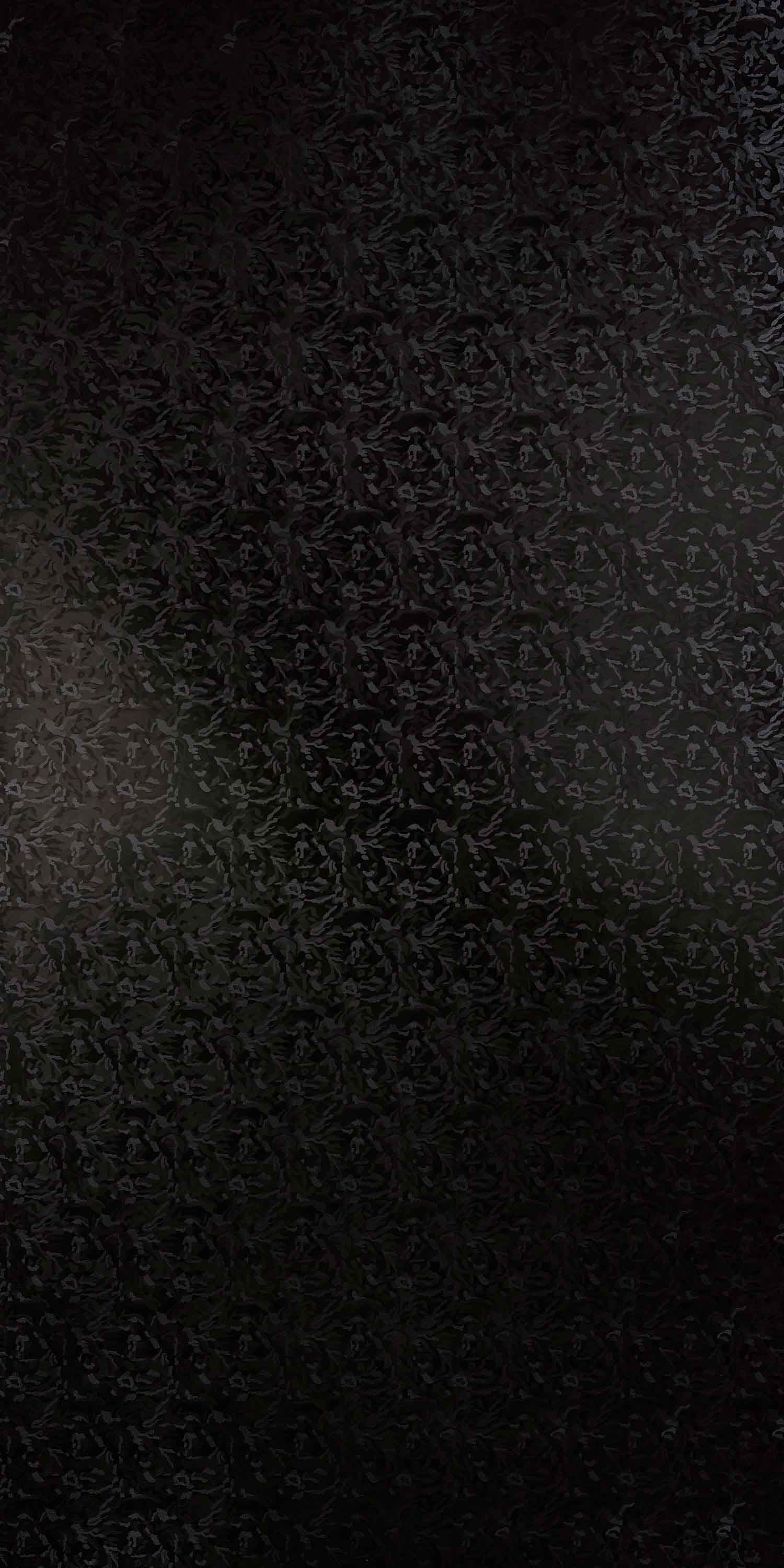 Black abstract suede laminate with textured finish and subtle pattern variation, showing dark tone and matte sheen