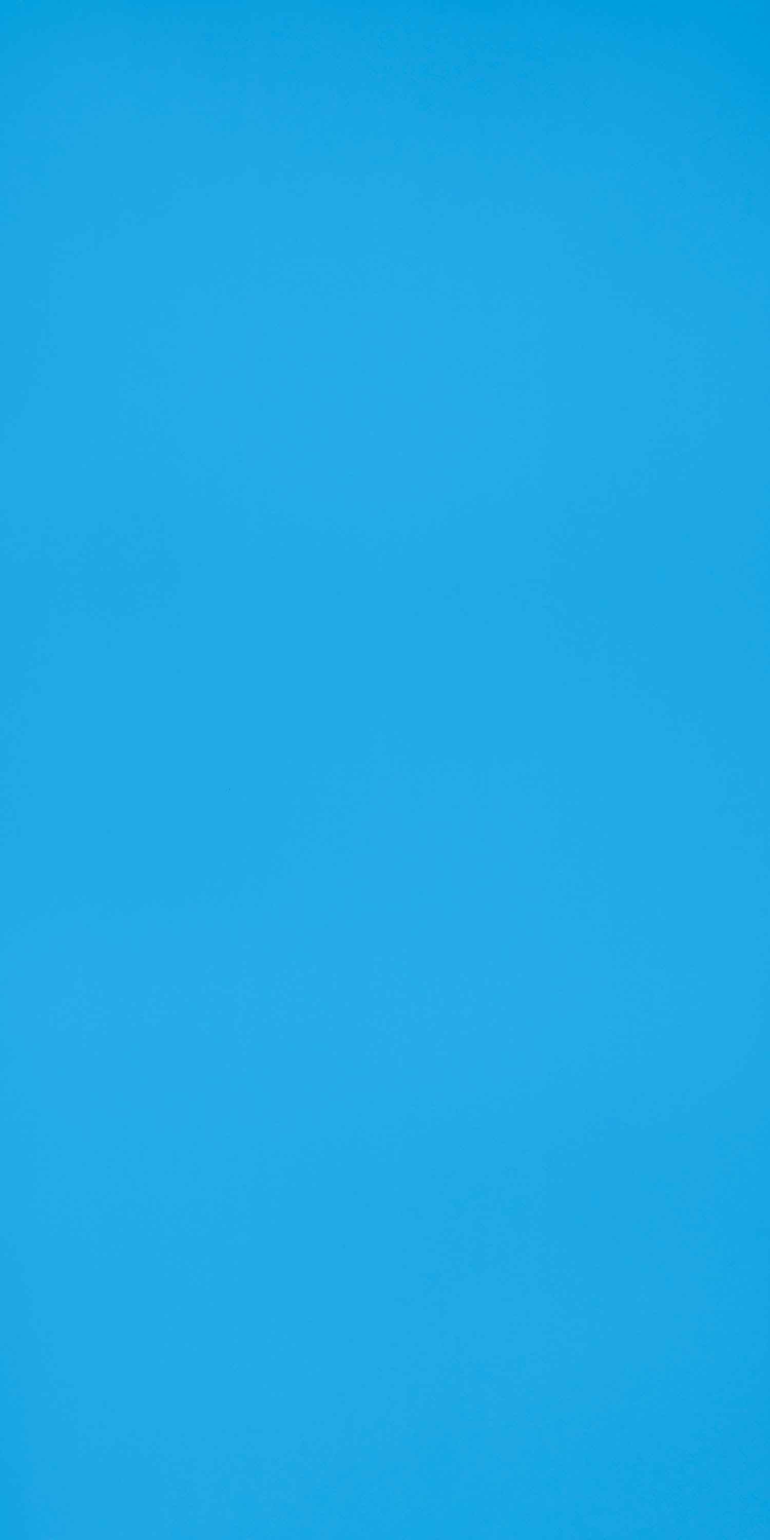 Blue laminate wall panel with high gloss finish and solid color appearance.