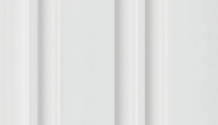 White fluted wall panel with textured finish and vertical grooves, showing a close-up of the louver's surface pattern and