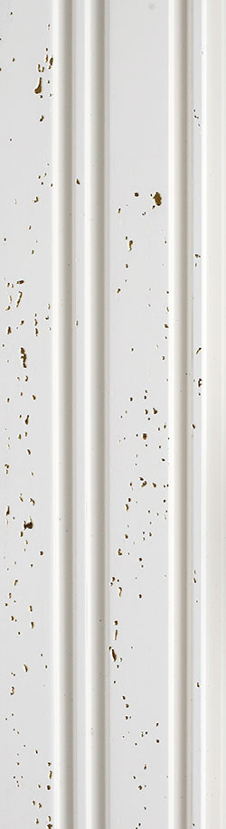 White textured louver panel with gold speckles and vertical ridges, designer wall finish.