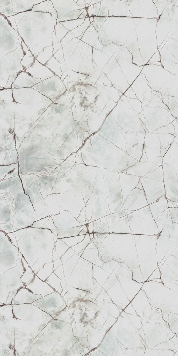 White marble laminate with suede finish and brown veining pattern, showing cracked texture and subtle sheen.