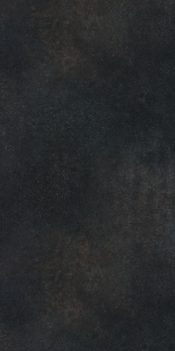 Black metallic suede laminate with subtle texture and dark sheen, showing a smooth surface with slight variations in tone.