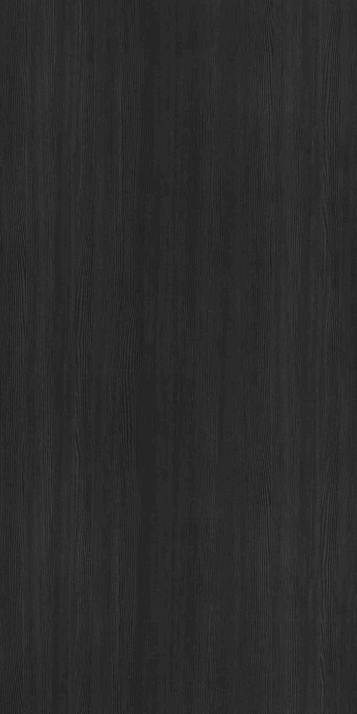 Black wood grain laminate with suede finish showing vertical wood texture and subtle grain pattern