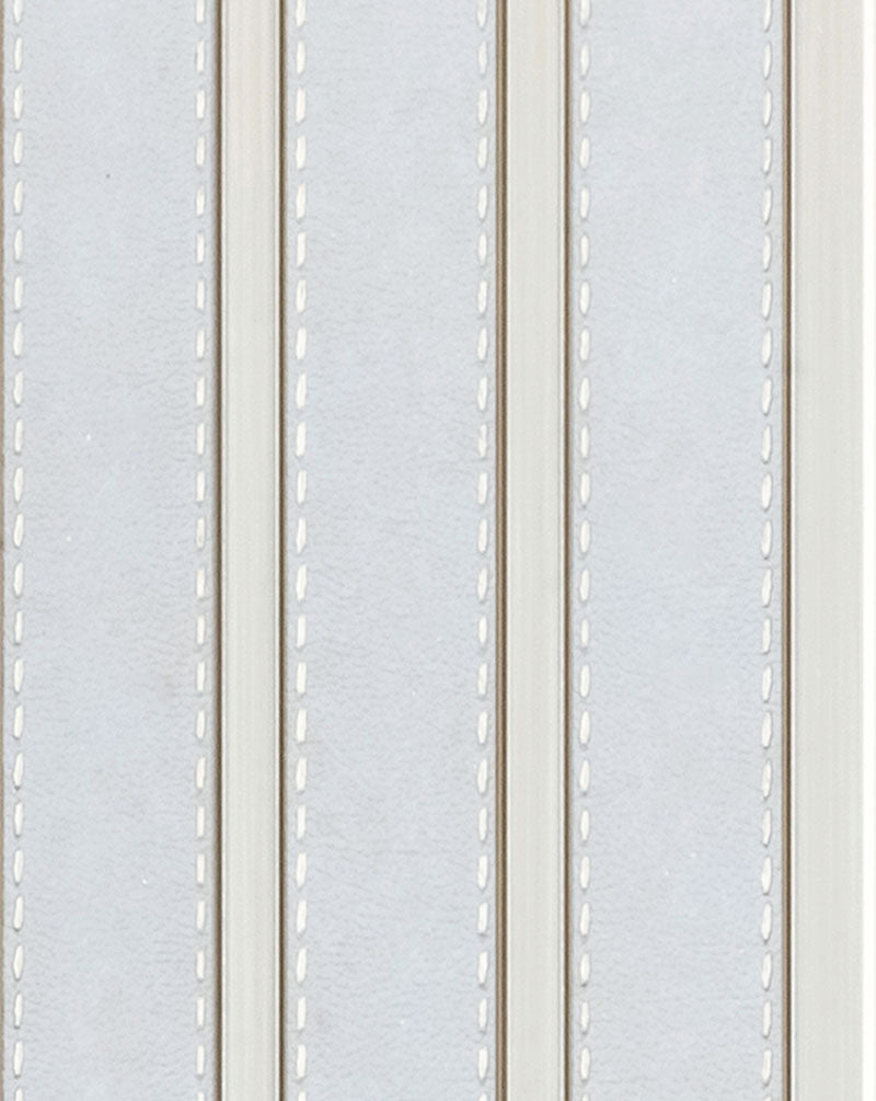 White fluted wall panel with textured finish and vertical grooves, showing detailed pattern and surface texture of louver