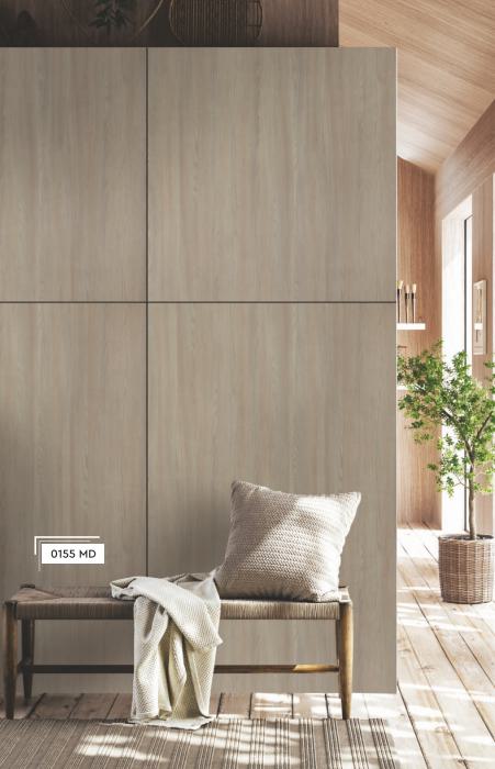 Brown wood grain laminate with textured finish, visible in large panels on a modern room's wall and floor.