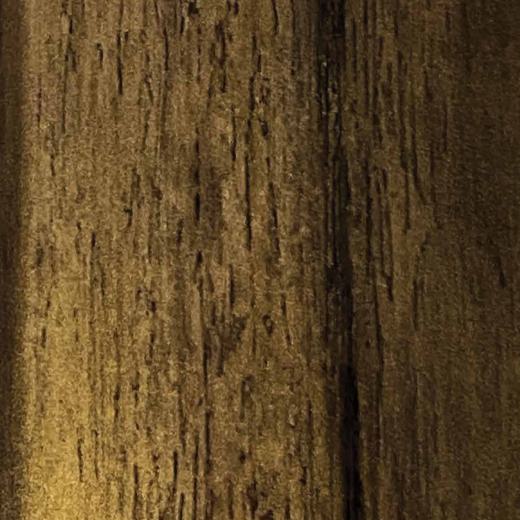 Brown wood grain decorative laminate with textured vertical pattern and dark brown streaks and subtle sheen