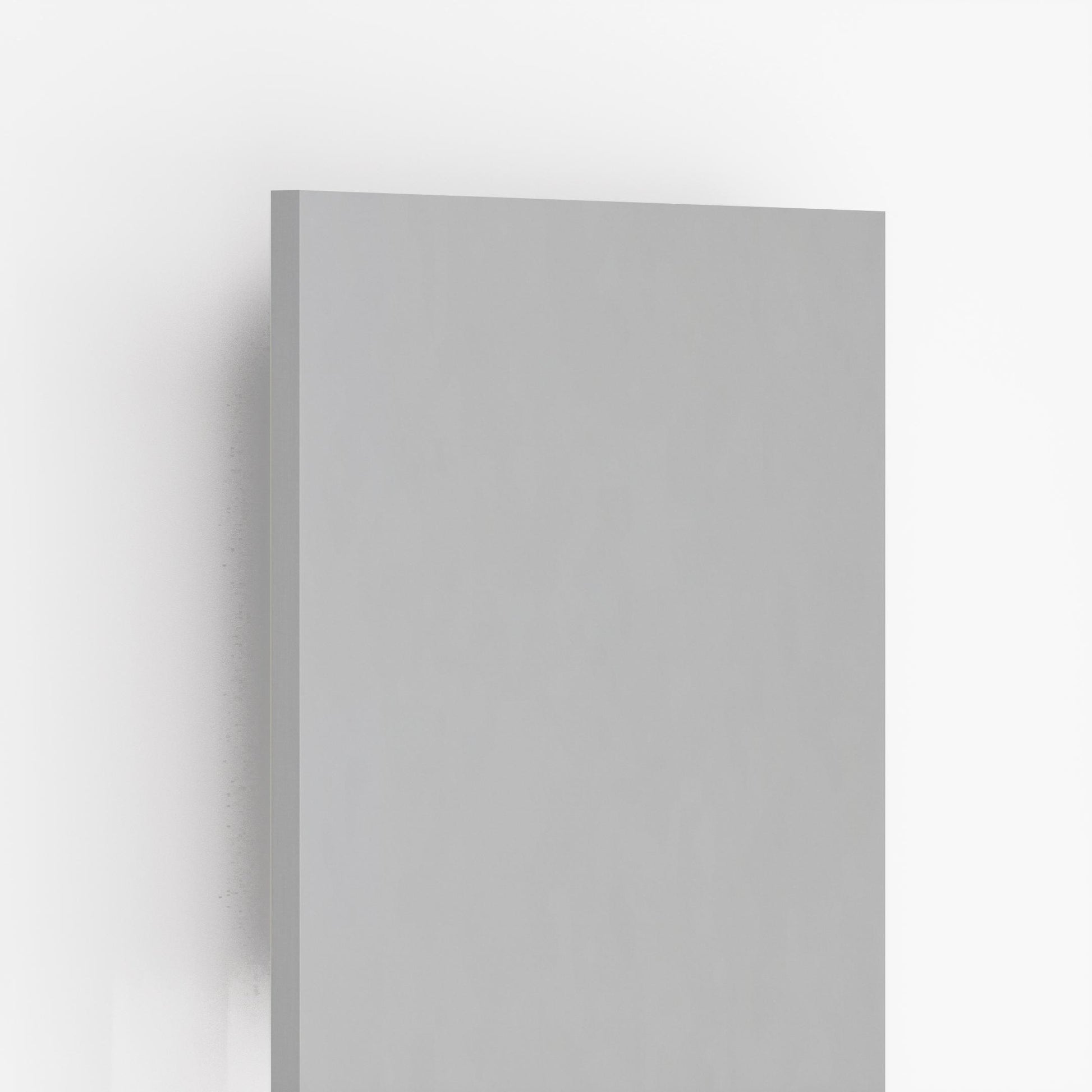 Grey high gloss plain laminate sheet with smooth finish and reflective surface, showing edge detail and subtle shadow effect.