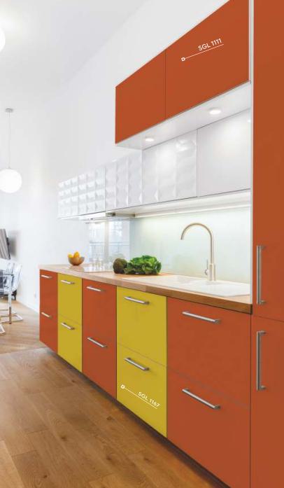 Orange high gloss laminate kitchen cabinets with silver handles and white backsplash in a modern kitchen setting.