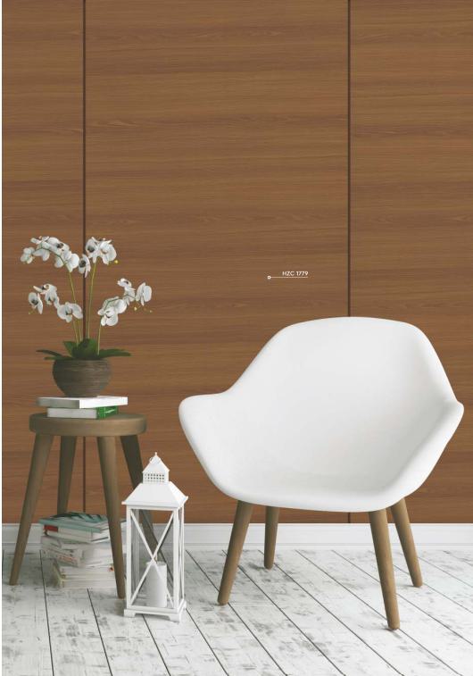 Brown wood grain laminate with textured finish and visible grain pattern on wall behind white chair and decorative items.
