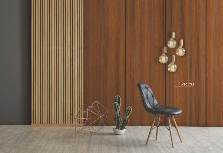 Brown wood laminate wall with textured finish and wood grain pattern in a modern interior design setting with decor items.