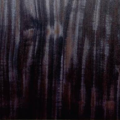 Dark wenge wood laminate with textured finish and vertical wood grain pattern, showing subtle sheen and varied brown tones