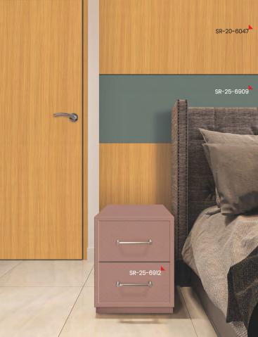 Hunter green plain laminate with texture finish used on wall behind bed and nightstand in modern bedroom setting