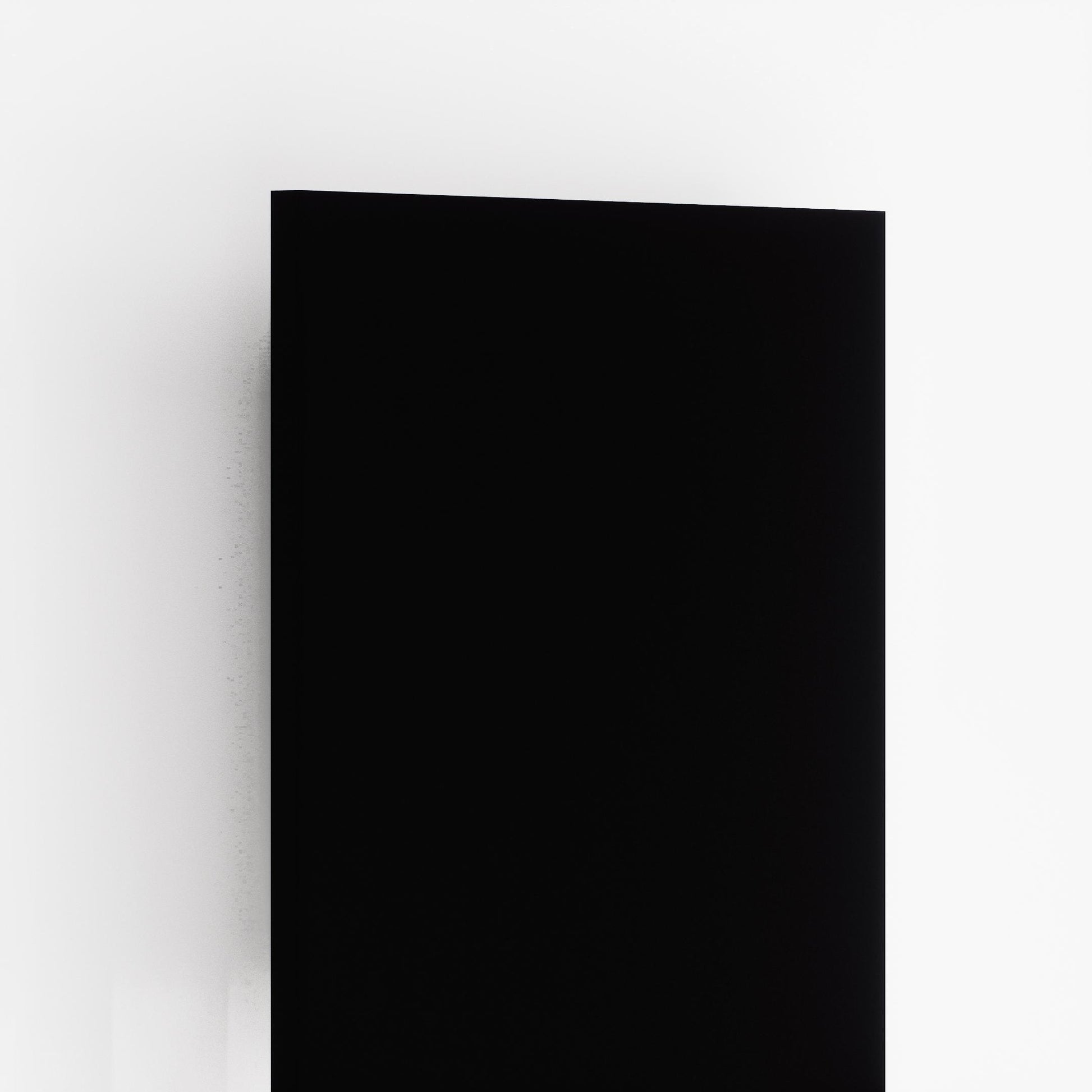 Black suede laminate wall panel with matte finish and smooth texture on white background