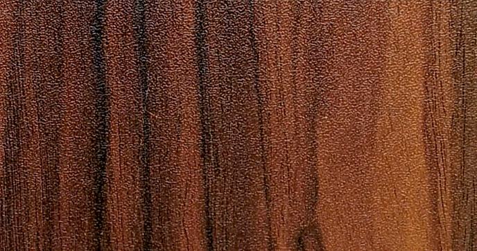 Brown wood grain laminate with textured finish and vertical grain pattern.
