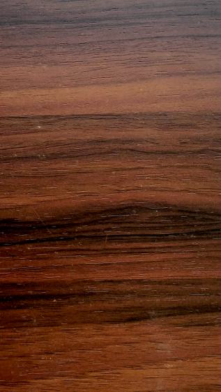 Brown wood grain laminate with textured finish and horizontal wood pattern, showing natural grain variation and texture