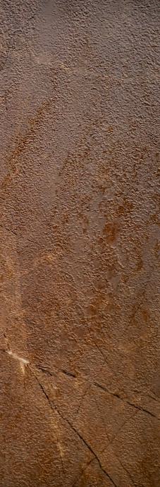 Brown wood grain laminate with textured finish and visible wood pattern and scratches