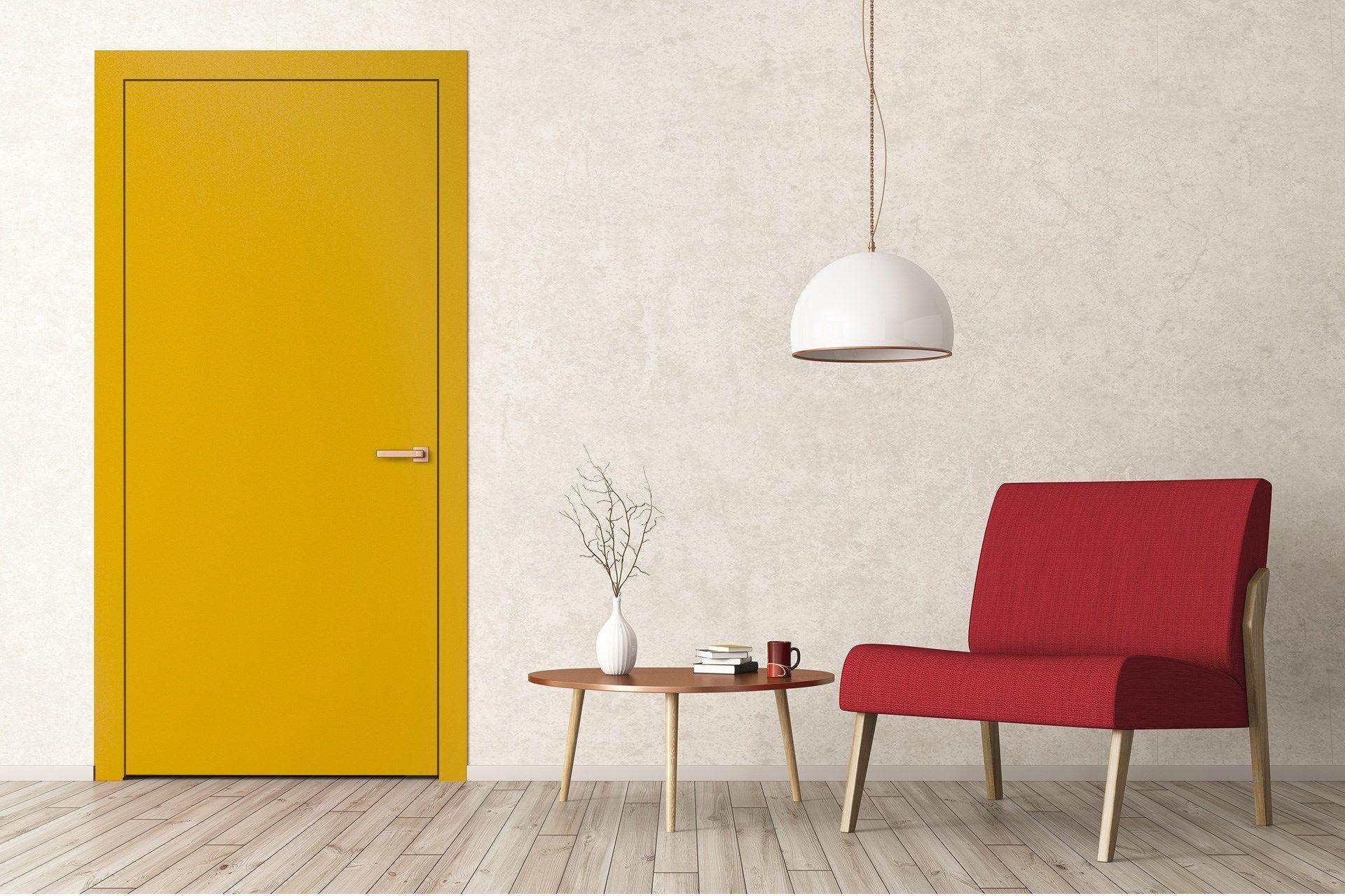 Yellow plain laminate door in a room with red chair and white pendant lamp against textured beige wall and wooden floor