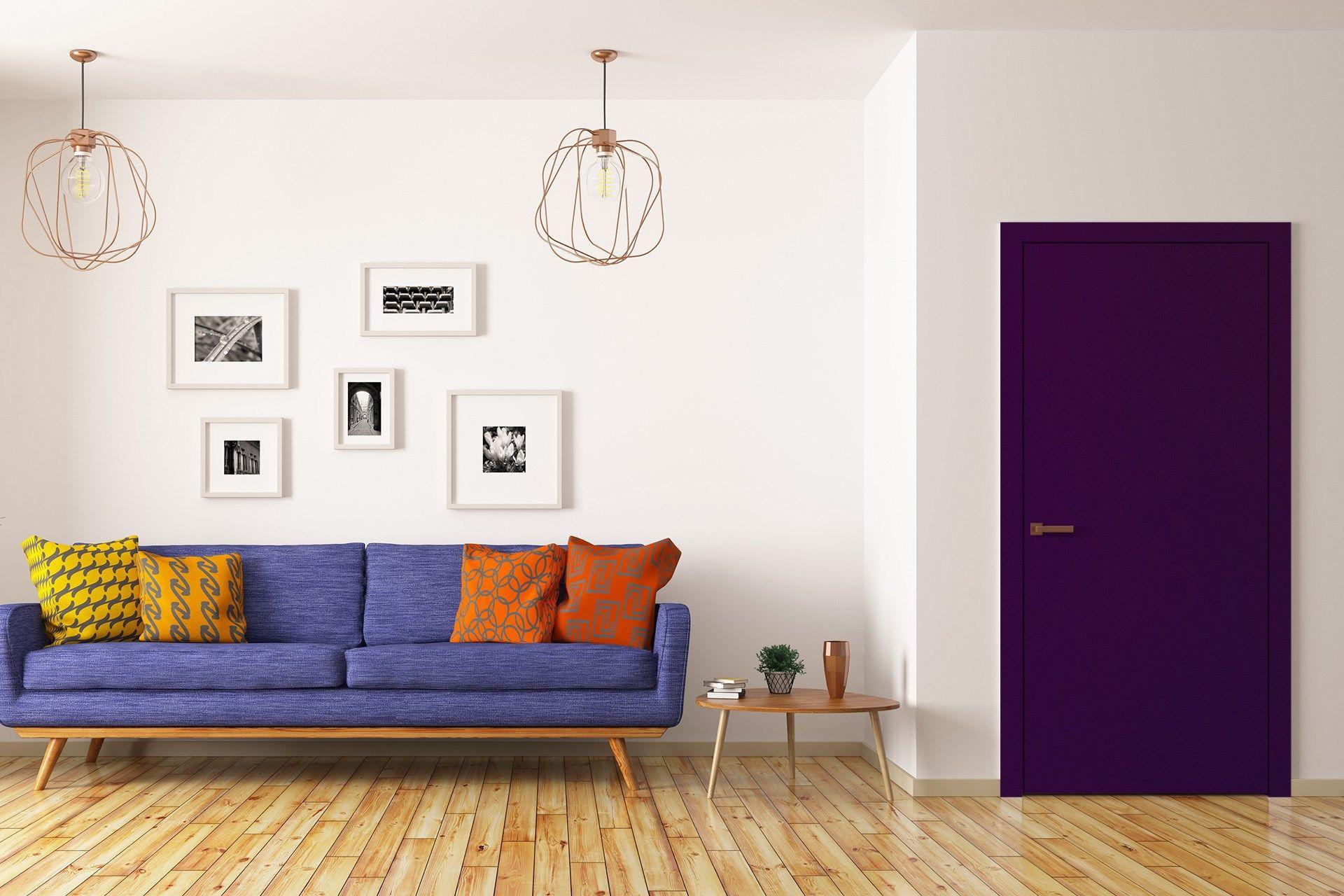 Purple laminate door in modern living room with blue sofa and wooden floor showcasing interior design and decor inspiration