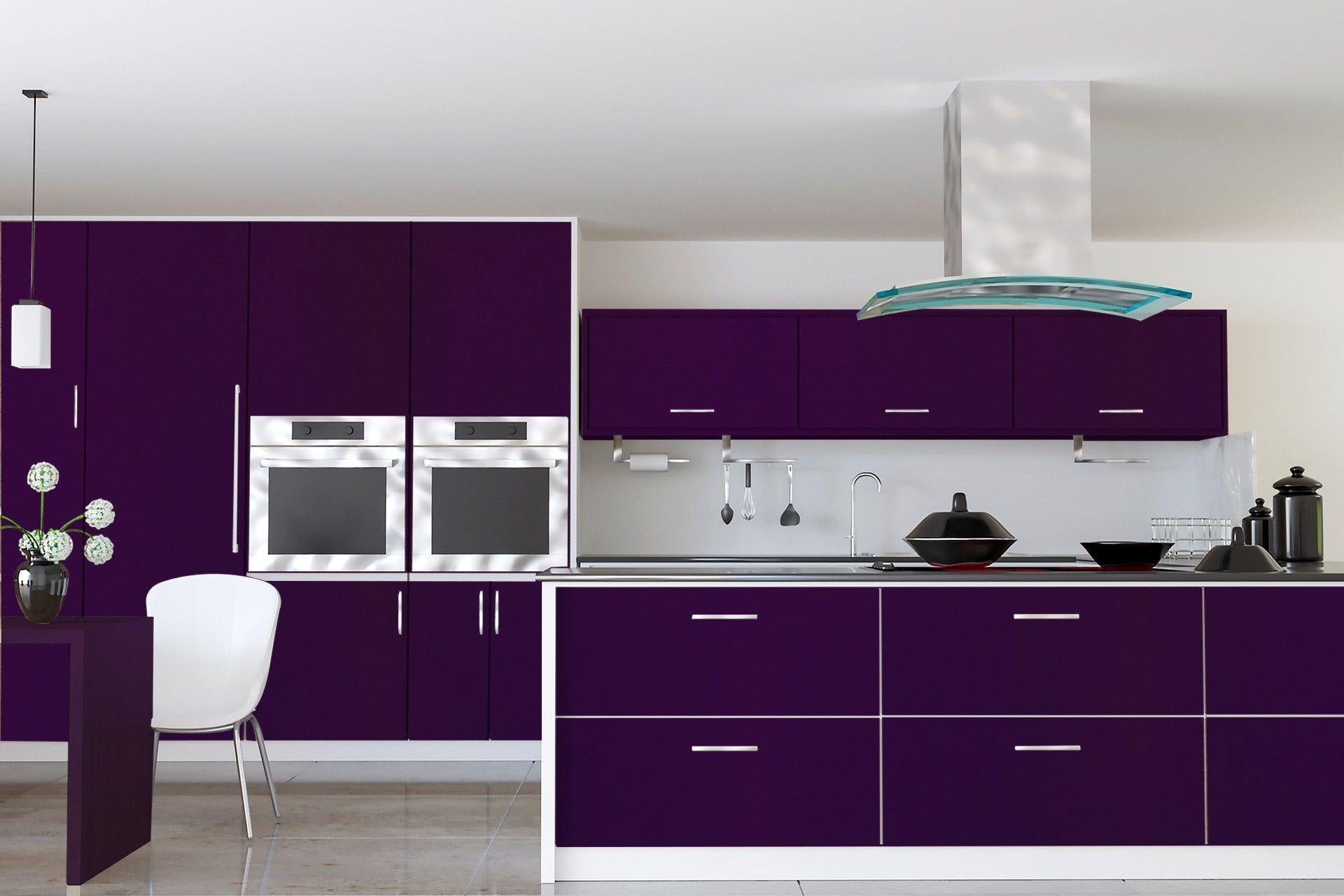 Purple laminate kitchen cabinets with suede finish and silver handles in a modern kitchen setting with stainless steel