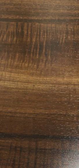 Dark brown wood grain laminate with textured finish and visible wood pattern and grain variation