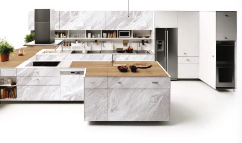 White marble laminate kitchen with glossy finish and veined pattern on cabinets and backsplash, modern appliances and wooden