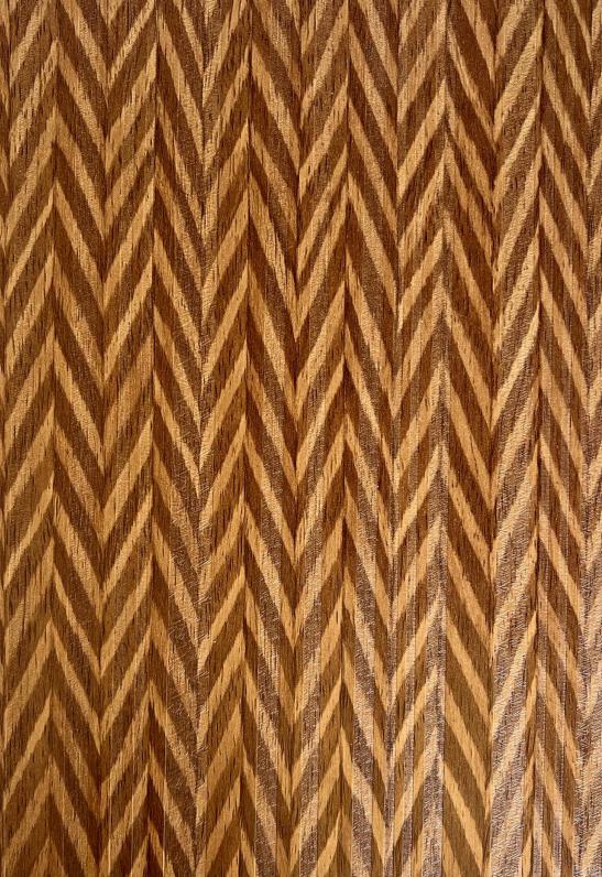 Brown wood laminate with textured herringbone pattern and visible wood grain.