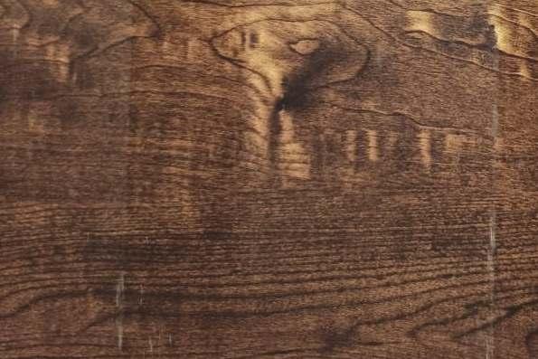 Brown wood grain laminate with textured finish and visible wood pattern details and natural grain variation.