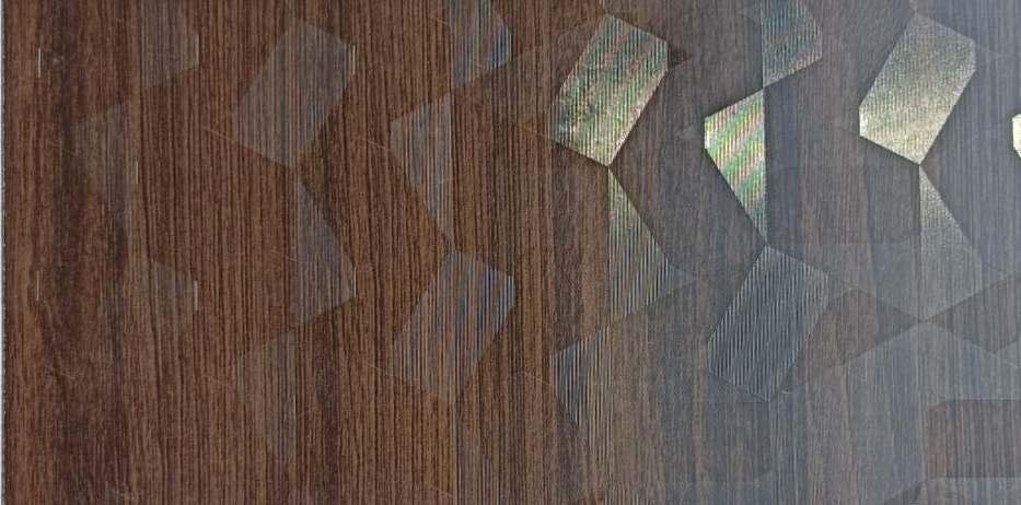 Wenge wood laminate with textured finish and visible wood grain, featuring geometric pattern and subtle sheen on right side.