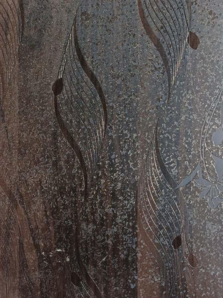 Dark wenge wood laminate with textured finish and abstract leaf pattern, showing wood grain and embossed details.