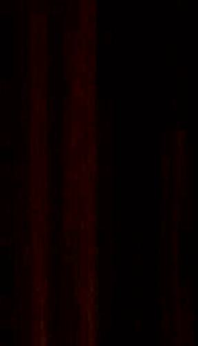Brown wood grain laminate with textured finish and dark red undertones, showing wood pattern and slight sheen variation.
