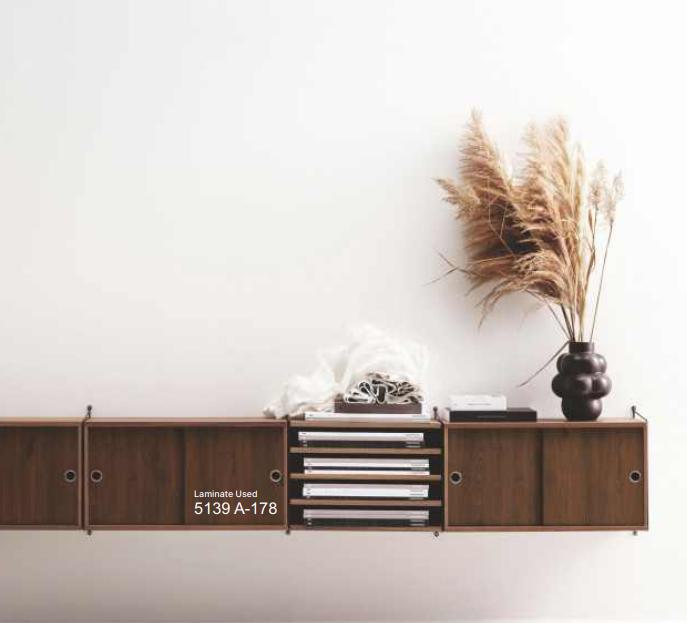 Brown wood grain laminate with textured finish on cabinet doors and shelves, displaying visible wood pattern and grain