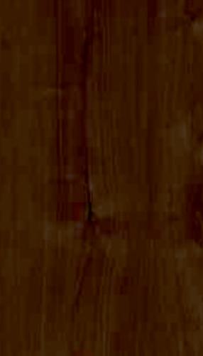 Brown wood laminate with suede finish, showing wood grain texture and dark brown color variation.