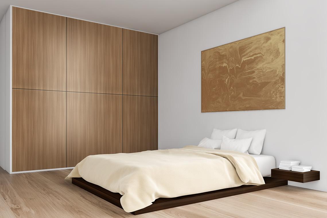 Brown wood grain laminate closet and bed frame in modern bedroom with suede finish and visible wood texture