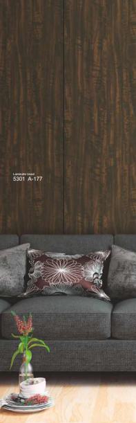 Brown wood grain laminate with textured finish and dark wood tone, used as wall decor behind a gray couch